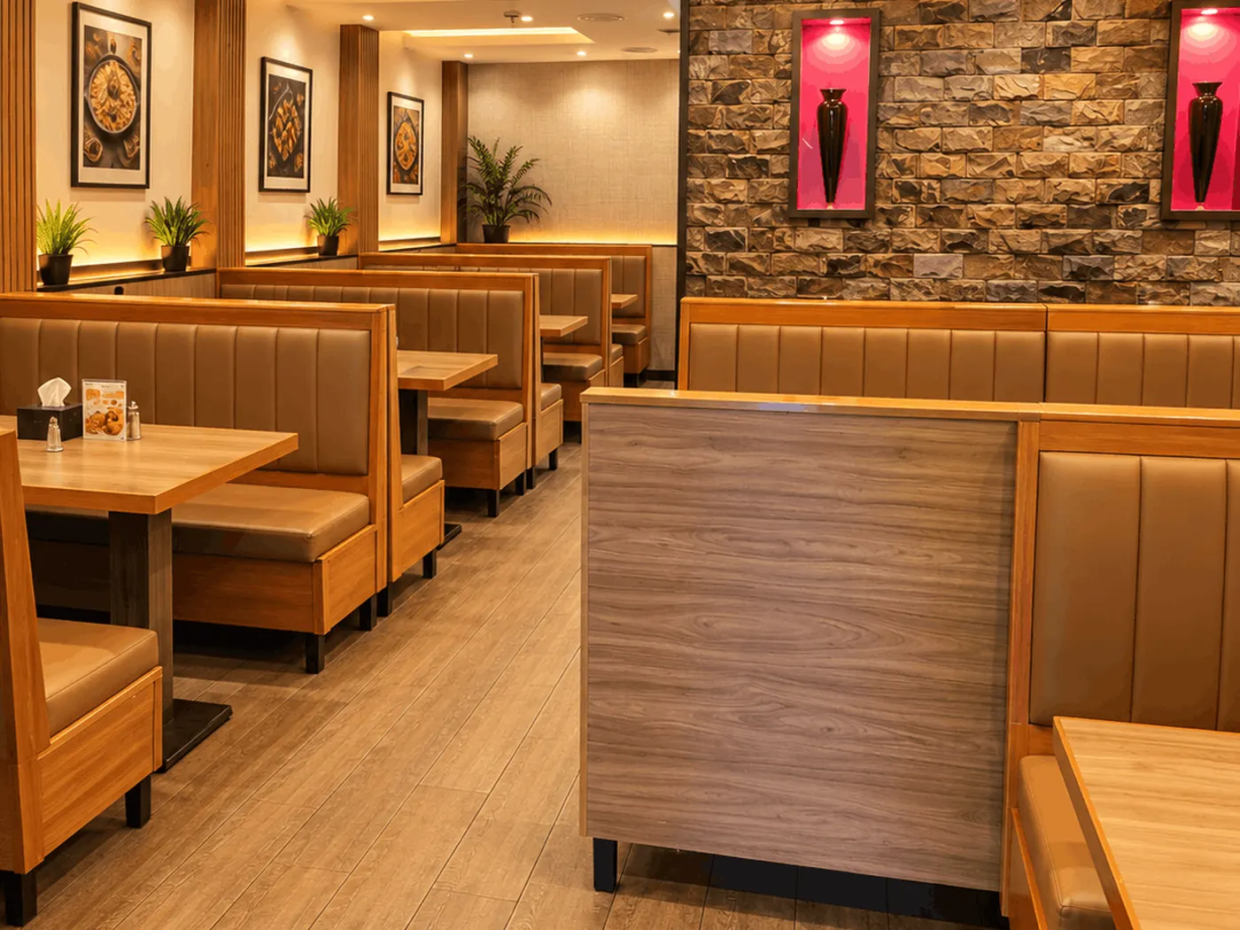 Low-lit King Chef dining room with tables set for service